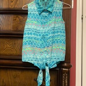 Ladies sleeveless shirt. Turquoise and multi color